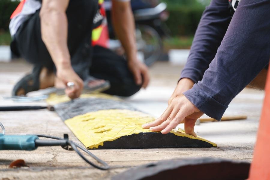 Installing a speed bump in a parking lot