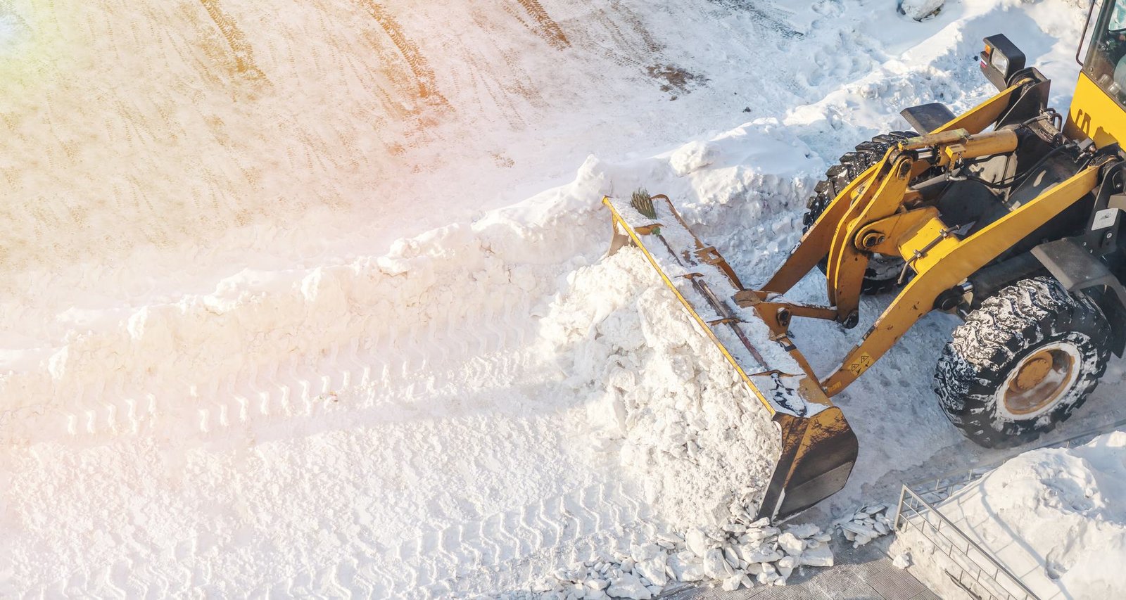 Aerial view of a loader clearing snow